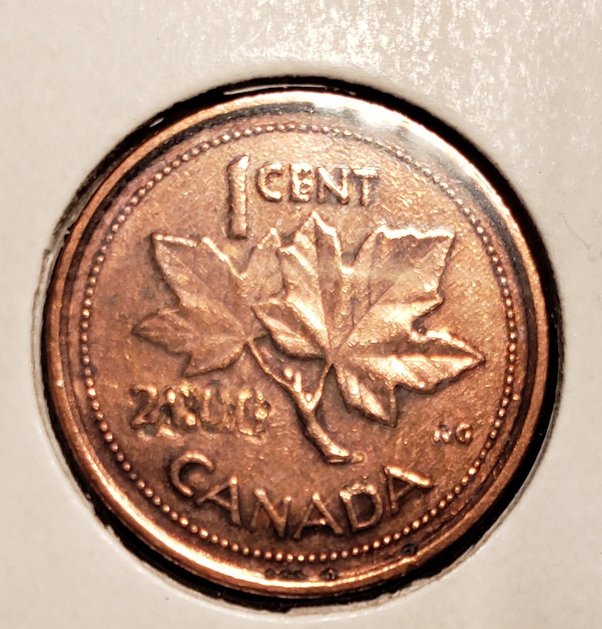 Corroded Canadian cent showing post-mint surface damage