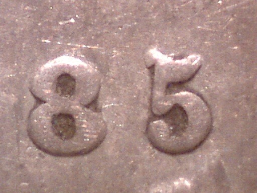 1885 Canadian 5-cent 5 over 5 re-engraved variety close-up