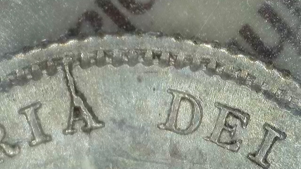 1875 Canadian five-cent coin with die crack