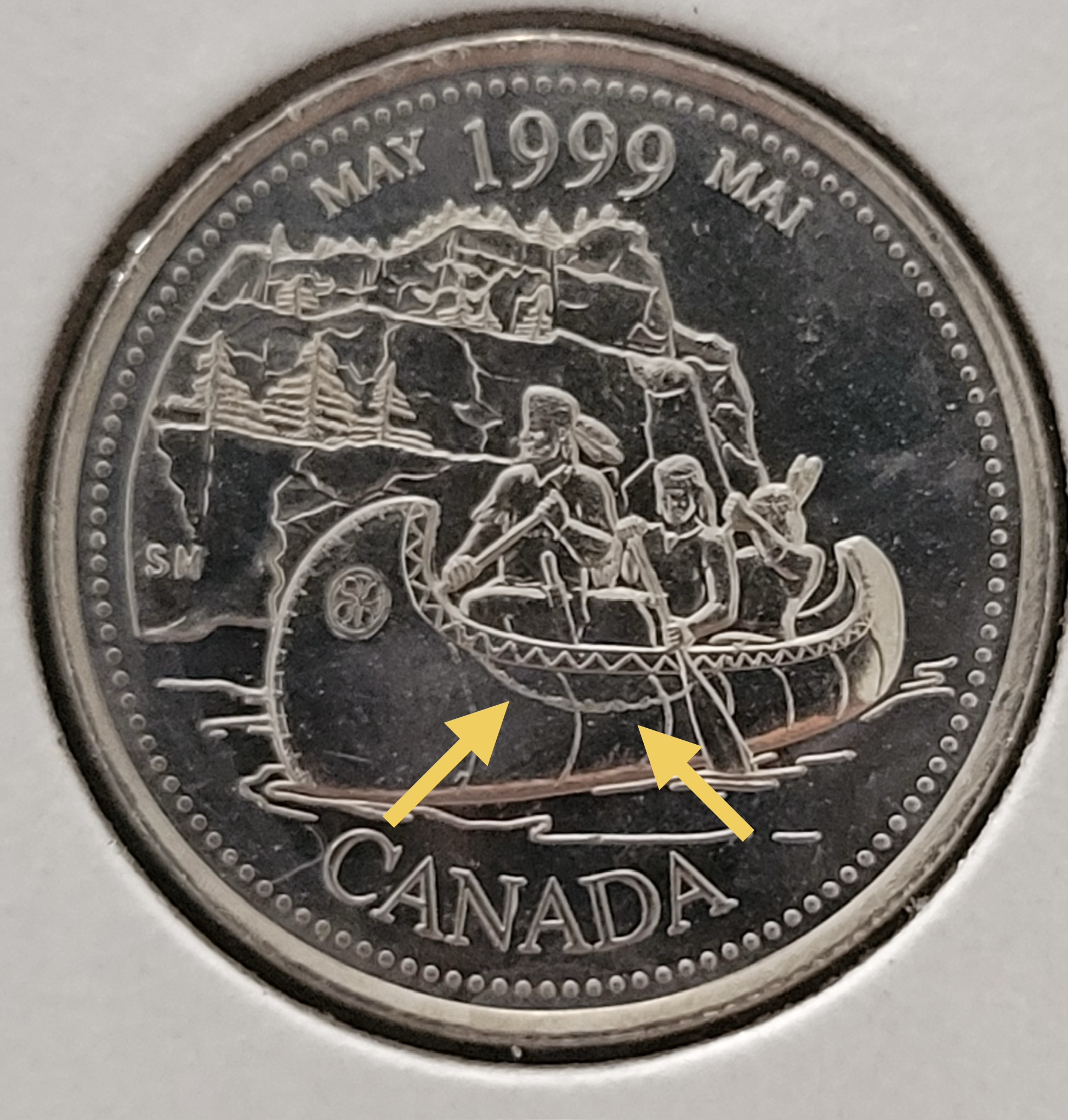 1999 May Canadian quarter, full reverse with arrows identifying the die crack in the foreground below the canoe